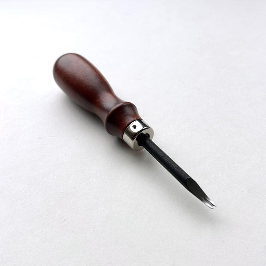 Wooden-handled WUTA leahter edge beveller tool with a metal blade on a white background