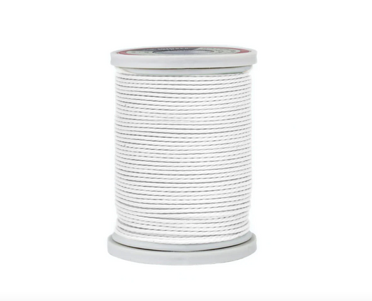 Spool of white thread on a white background