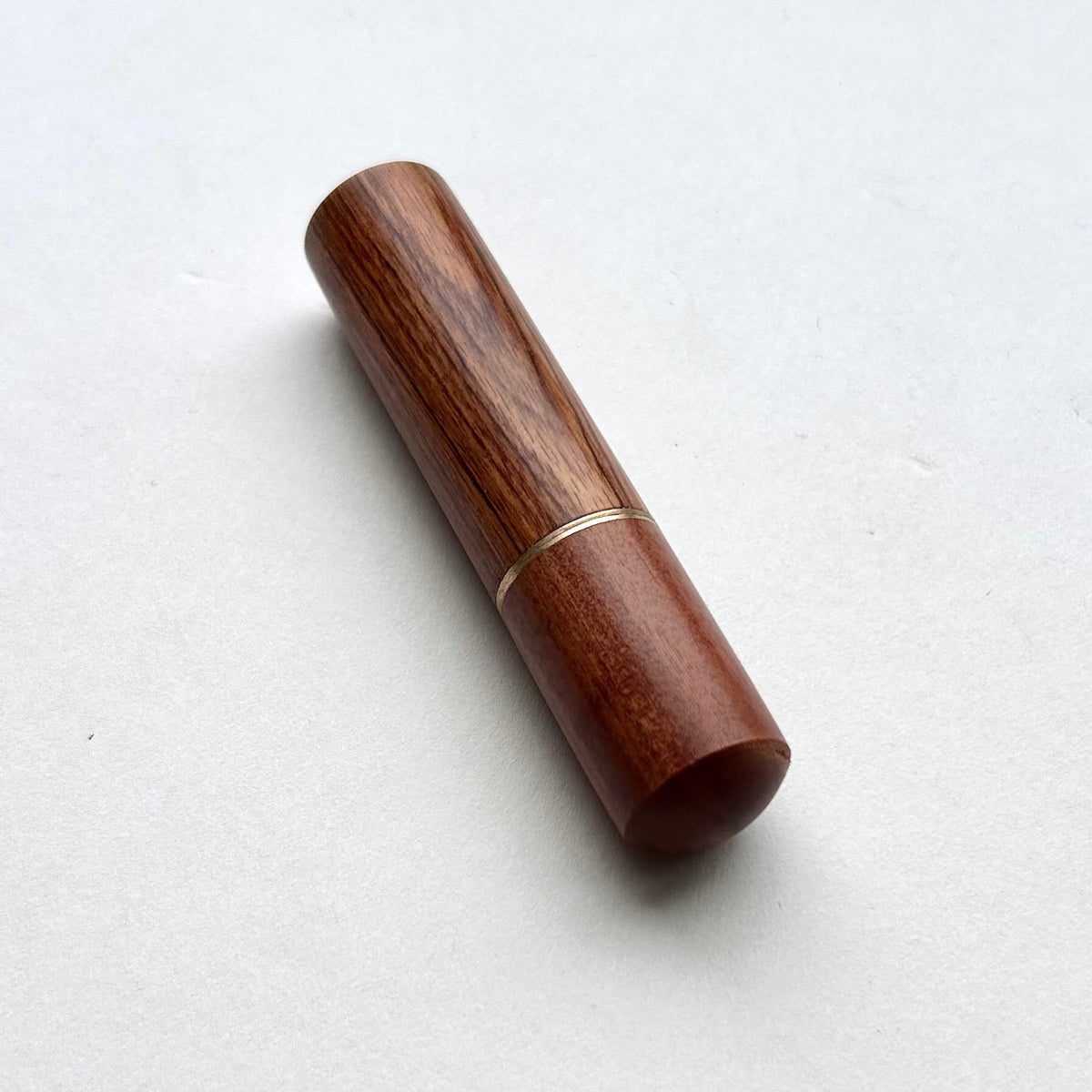 Wooden needle case with brass detail