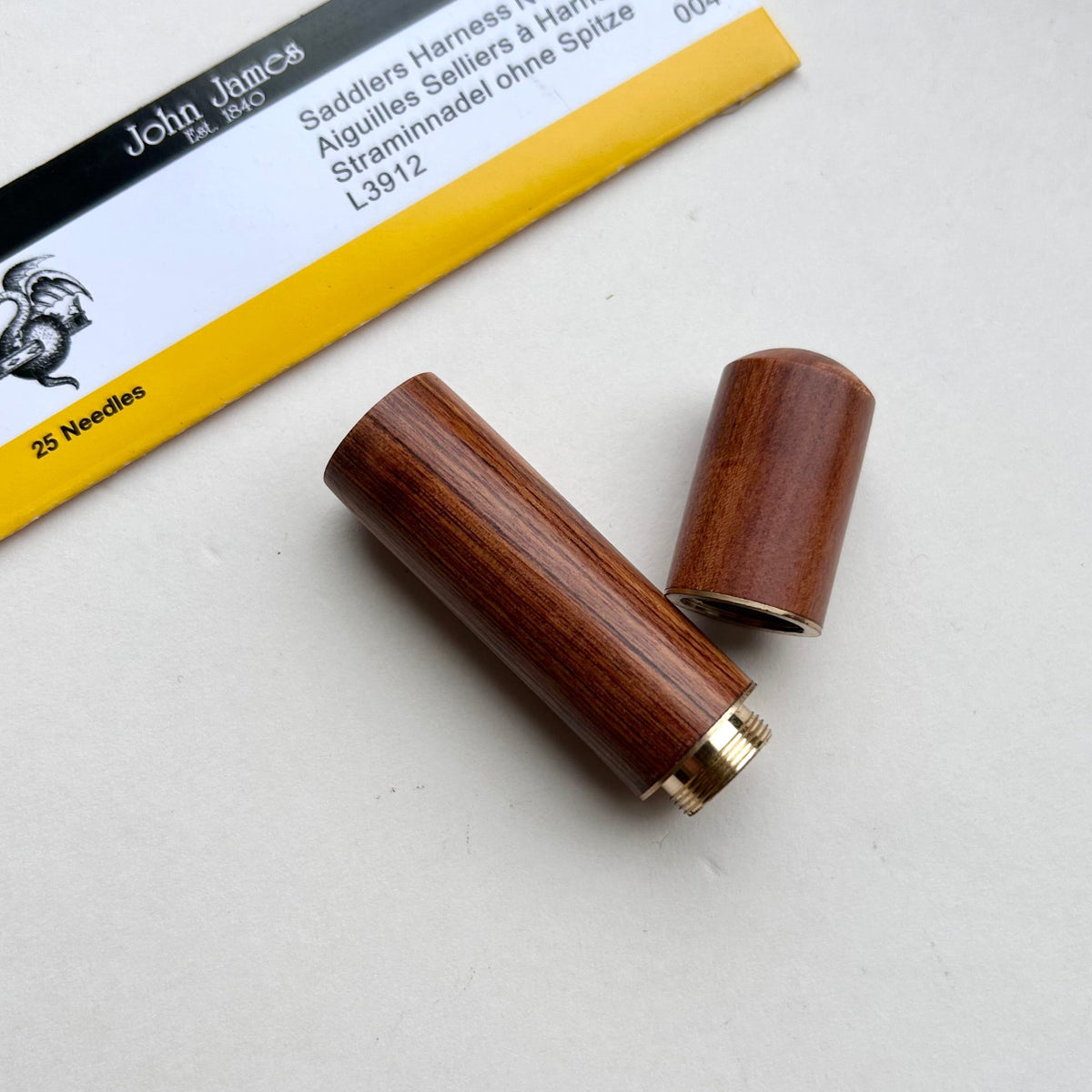 Wooden needle case with brass detail