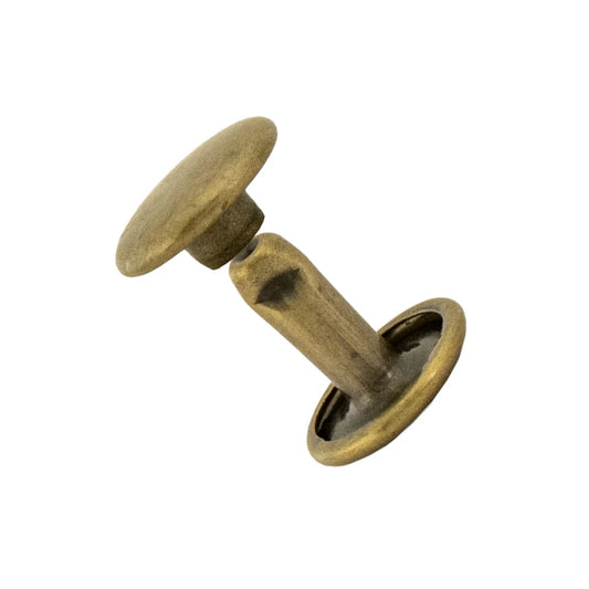 Bronze-colored metal leather rivets on a white background