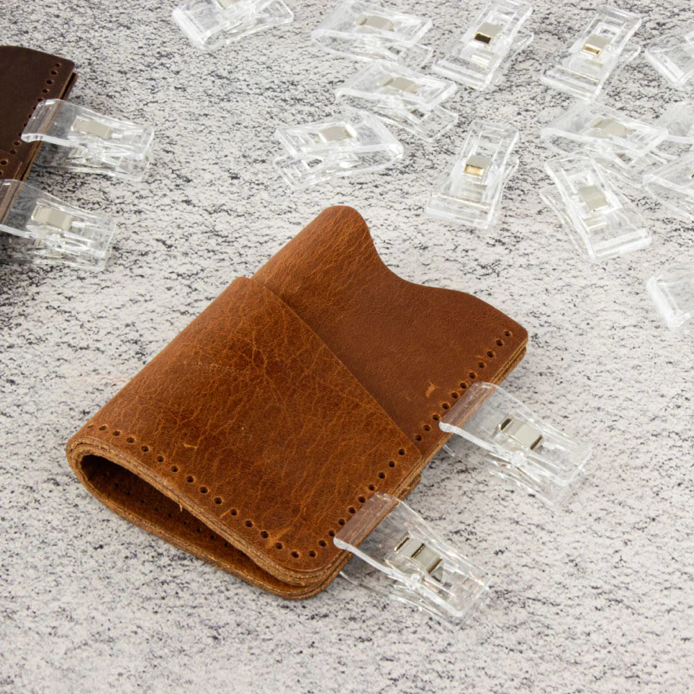 Leather edge clips in plastic