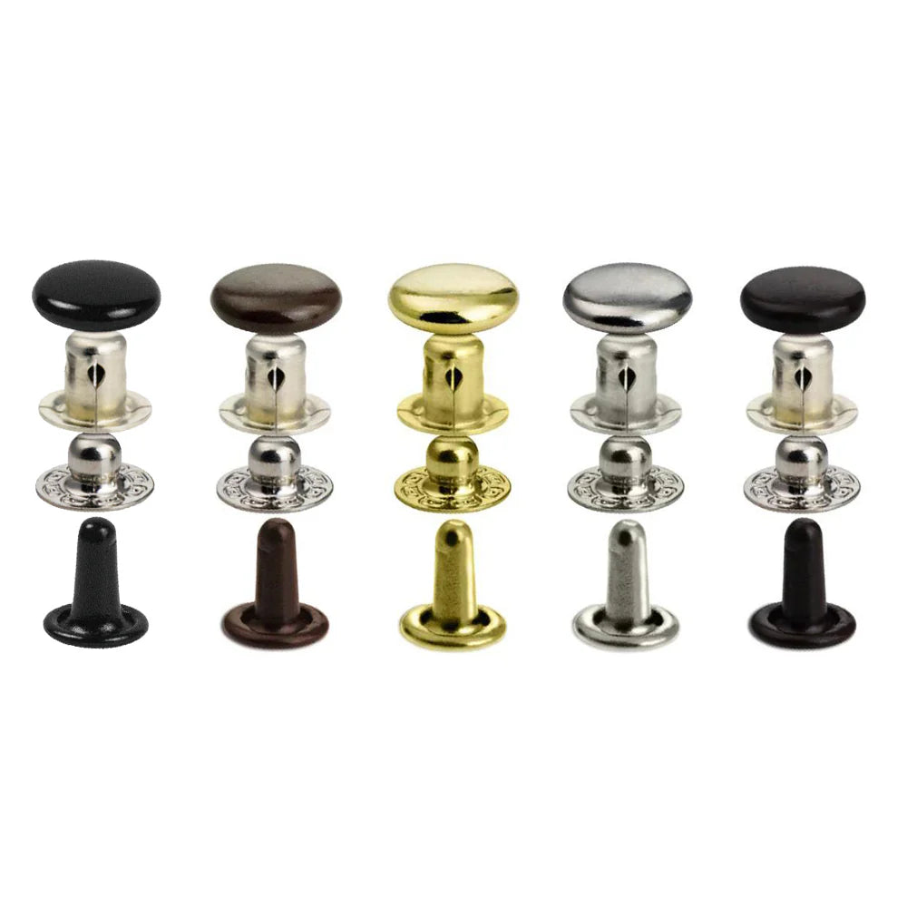 Set of metal press stud snaps in various colors on a white background