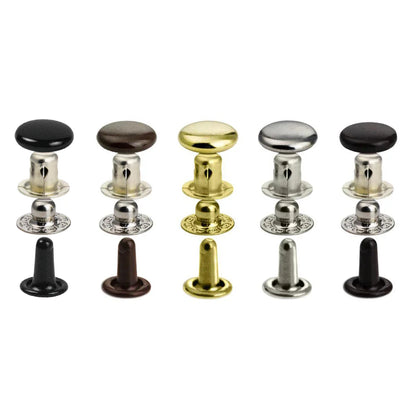 Set of metal press stud snaps in various colors on a white background